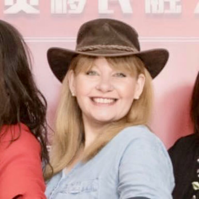 portrait of a woman wearing a cowboy hat